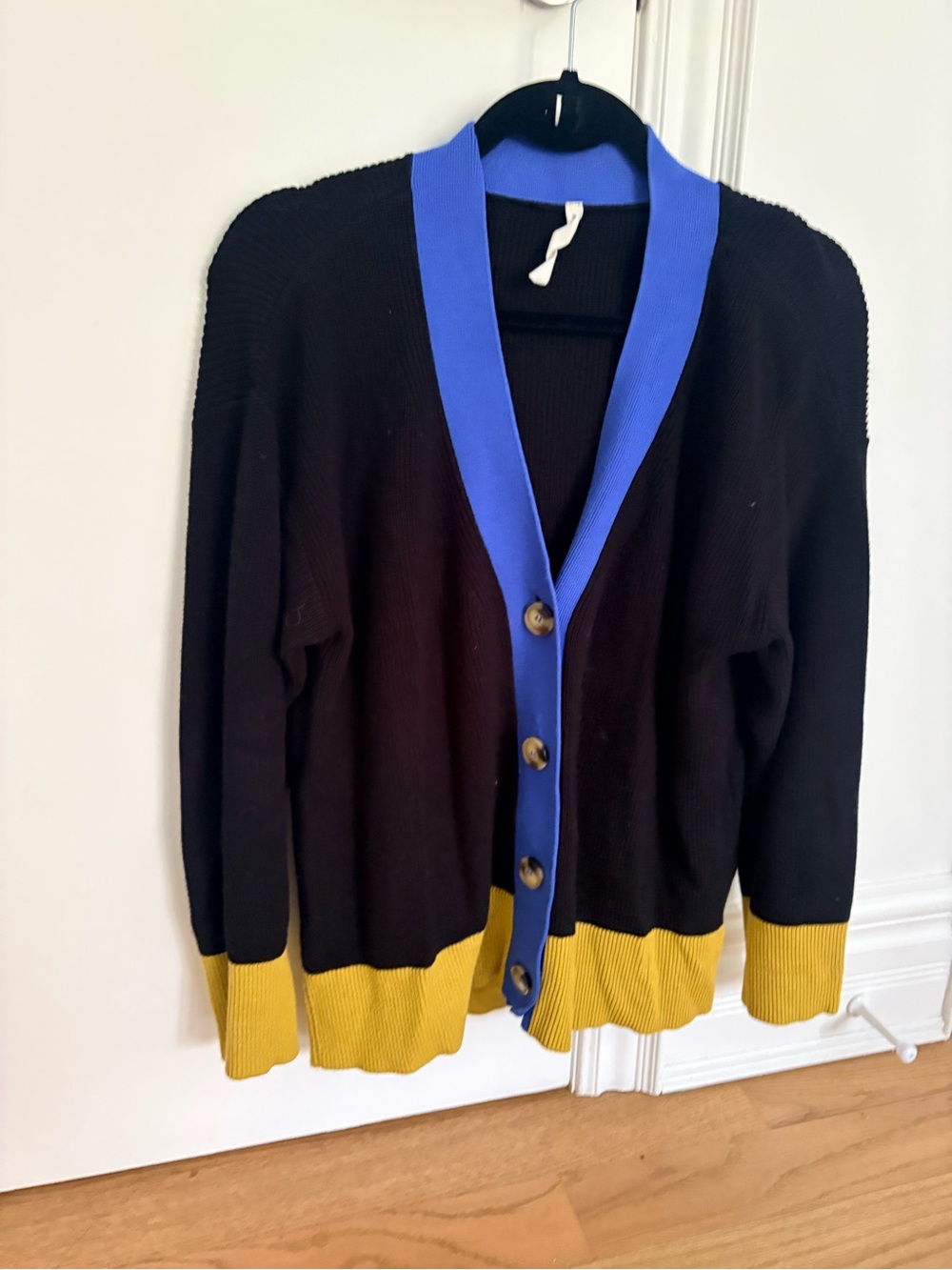 Women’s Paper Label Black Cardigan with Blue Trim and Yellow Hem